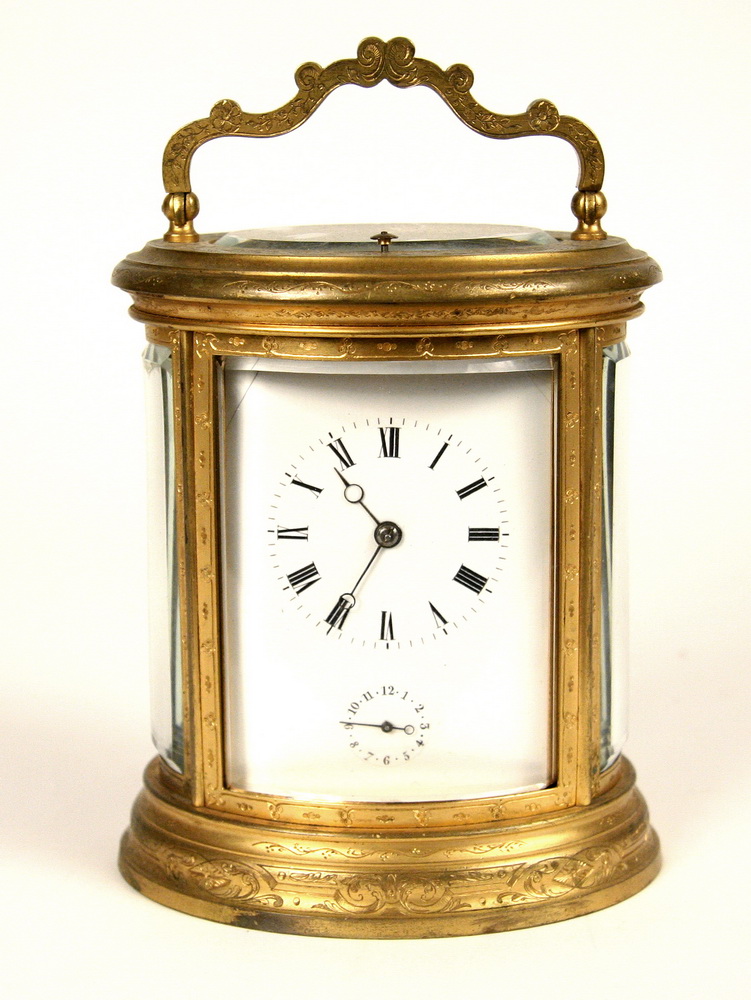OVAL CARRIAGE CLOCK - 19th c Gilt