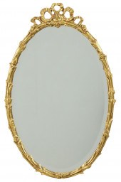 OVAL CARVED GILTWOOD MIRROR, F