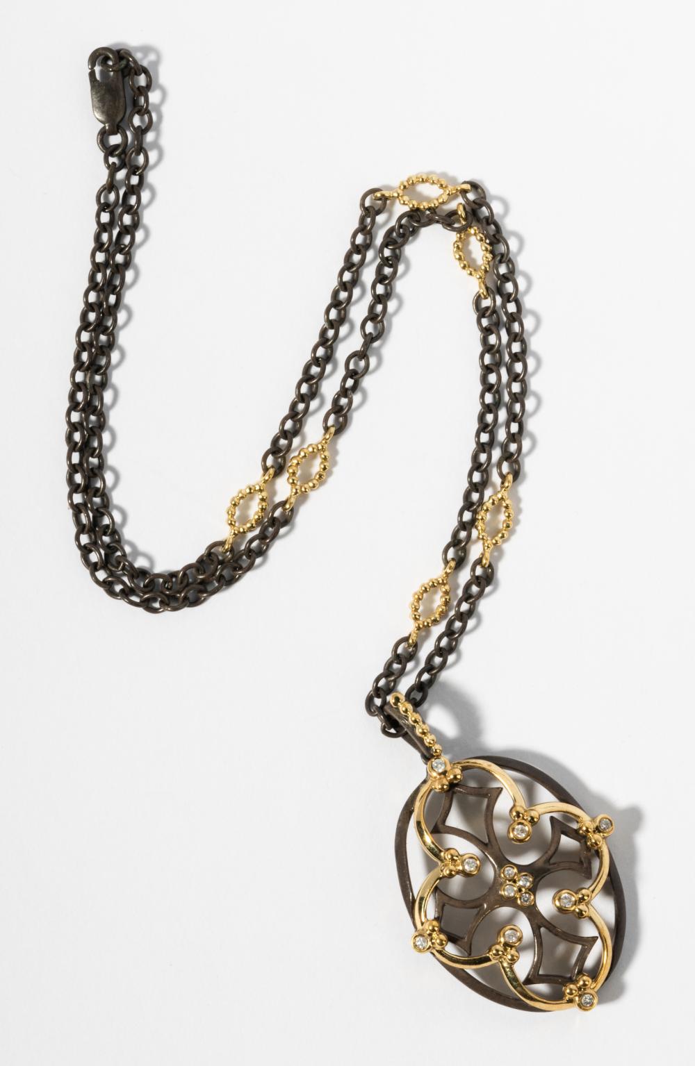 OXIDIZED SILVER AND 18 KARAT YELLOW