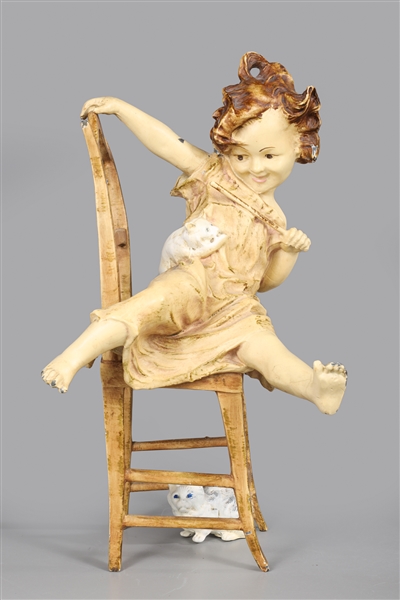 Painted bronze figure of a seated