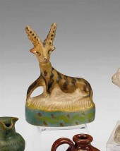 Painted chalkware kneeling fig