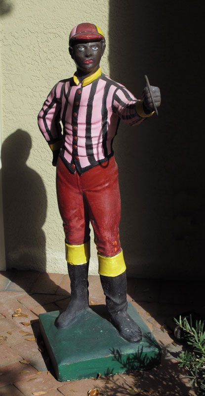 PAINTED CONCRETE LAWN JOCKEY: