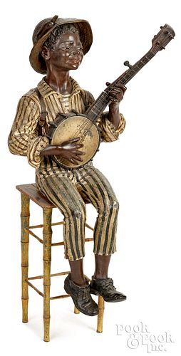 PAINTED METAL FIGURE OF AN