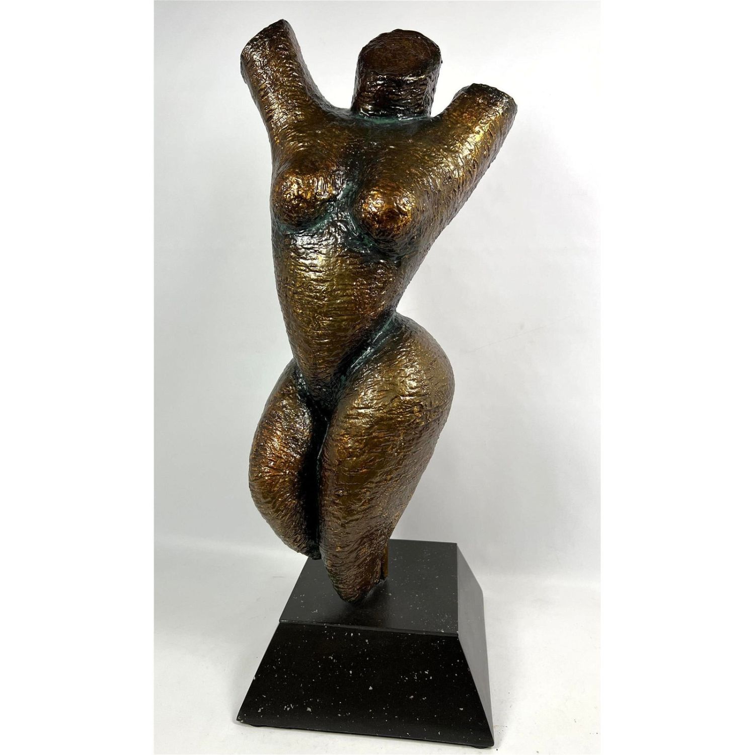 Painted plaster nude torso.