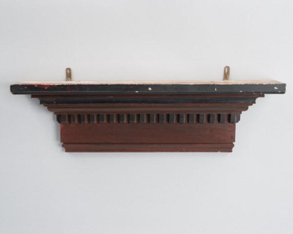 PAINTED WALL SHELFA wall shelf with
