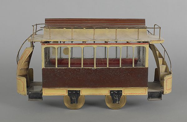 Painted wood and wire trolley car