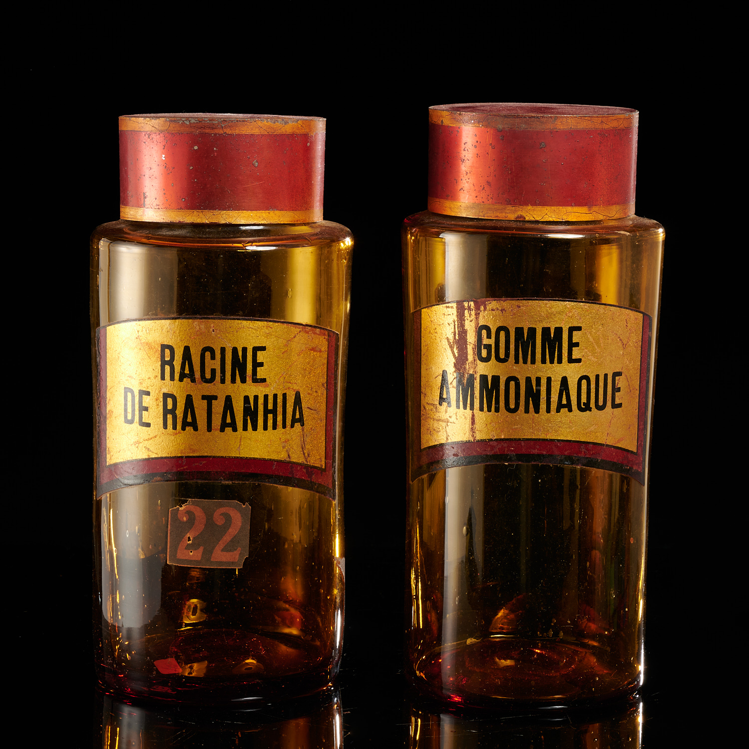 PAIR ANTIQUE AMBER GLASS APOTHECARY