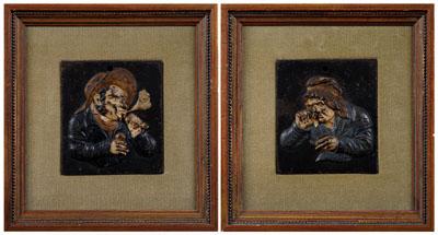 Pair iron figural plaques depicting