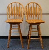 PAIR OAK SWIVEL COUNTER STOOLS