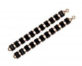 PAIR OF 14K GOLD AND ONYX BRAC