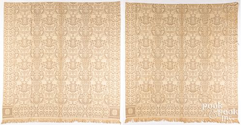 PAIR OF BEIGE JACQUARD COVERLETS,