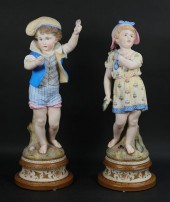 PAIR OF BISQUE PORCELAIN FIGUR