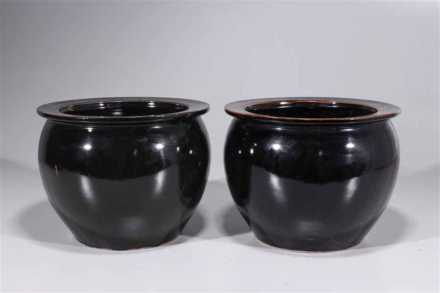 Pair of black porcelain vases;