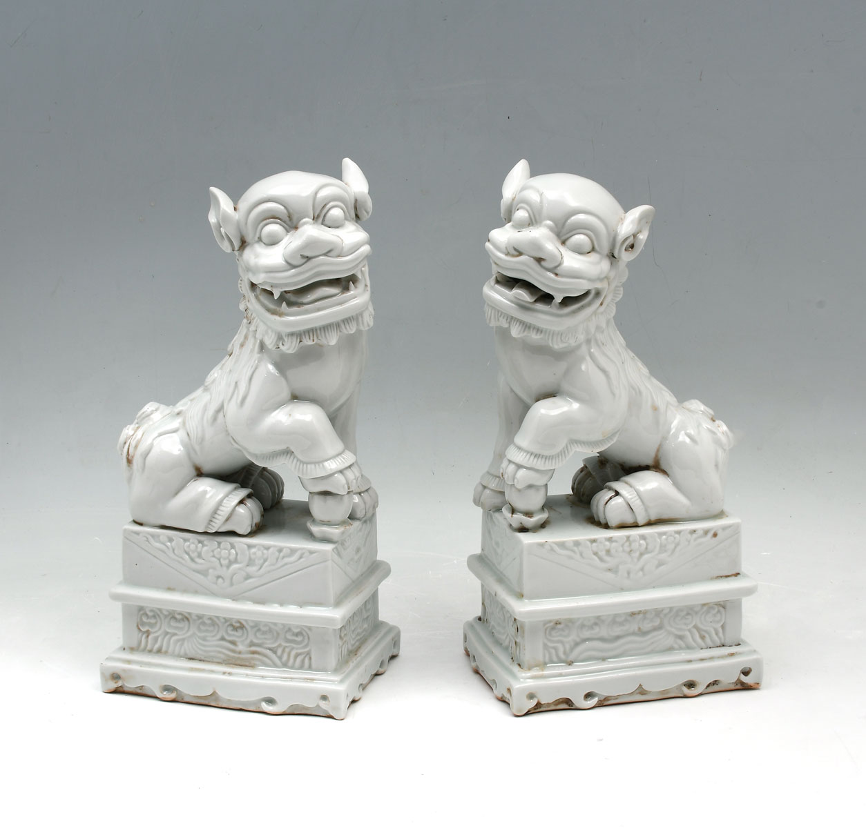 PAIR OF BLANC DE CHINE FOO DOGS: