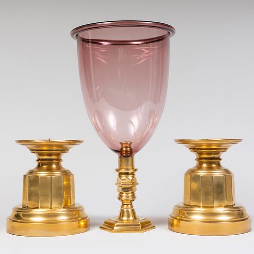 PAIR OF BRASS CANDLE HOLDERS AND AN