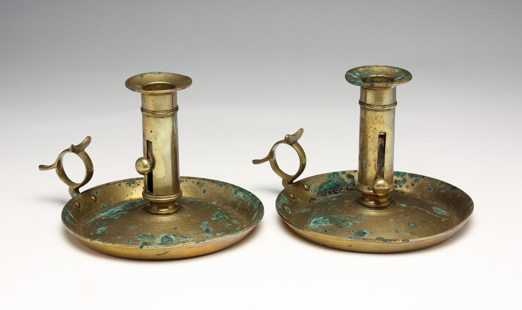 PAIR OF BRASS CHAMBERSTICKS.