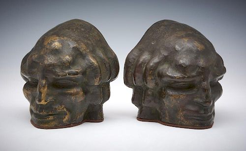 PAIR OF BRONZE BOOKENDS, FACE OF