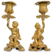 PAIR OF BRONZE CHERUB CANDLEST