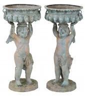 PAIR OF BRONZE CUPID FORM JARD