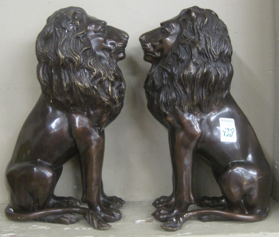PAIR OF BRONZE LIONS cast in