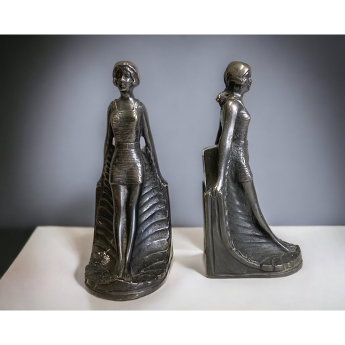 PAIR OF BRONZE SCULPTURAL BOOKENDS.
