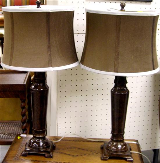 Pair of brown speckled metal column