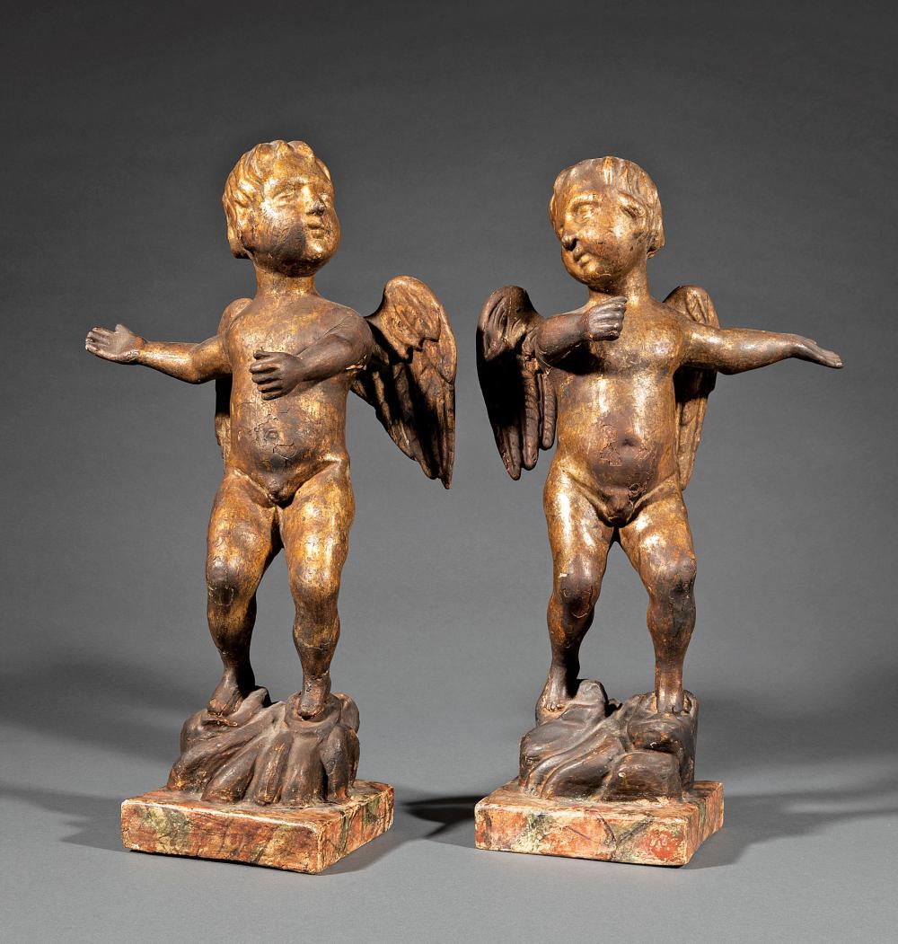 PAIR OF CARVED AND PATINATED