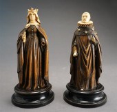 PAIR OF CARVED FIGURES OF SPAN