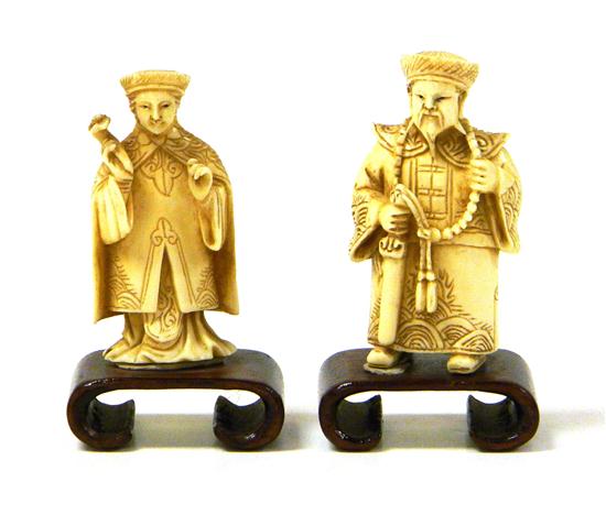 Pair of carved ivory figures 