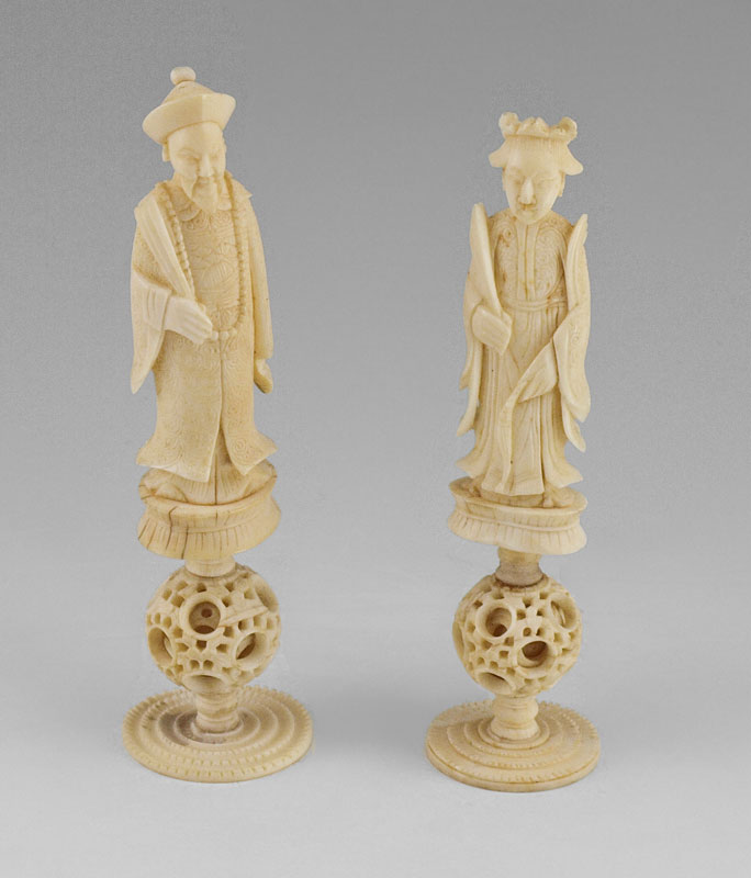 PAIR OF CARVED IVORY FIGURES ON