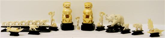 Pair of carved ivory foo dogs on