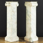 PAIR OF CARVED MARBLE IONIC CO