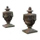 PAIR OF CARVED SANDSTONE ADAM