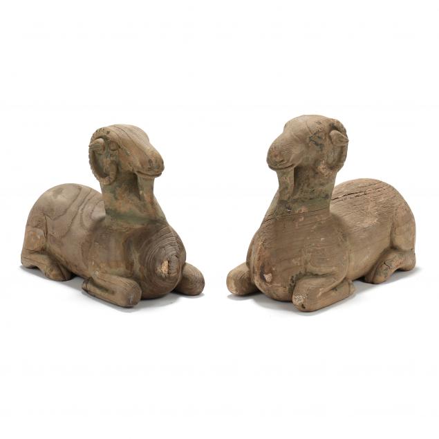 PAIR OF CARVED WOOD RECUMBENT
