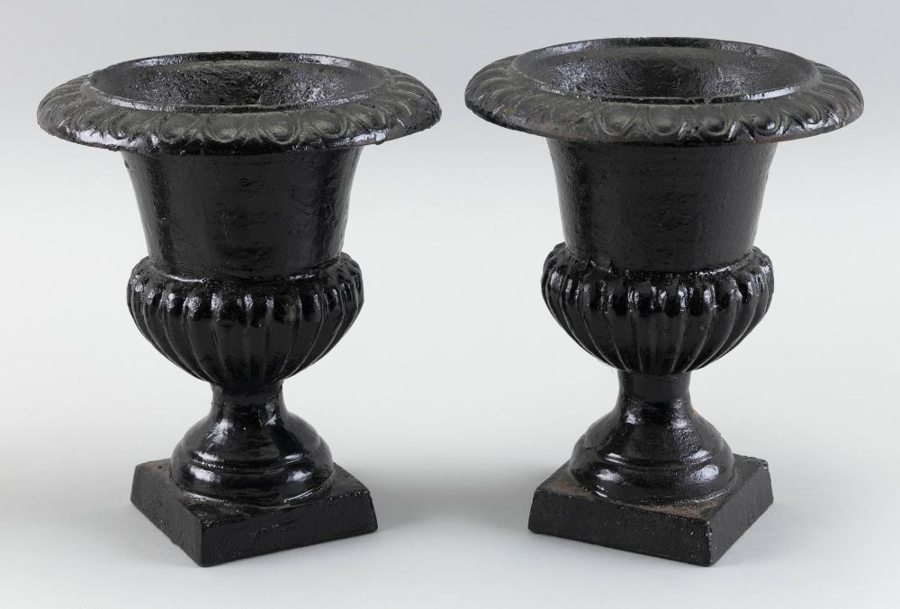 PAIR OF CAST IRON GARDEN URNS FIRST