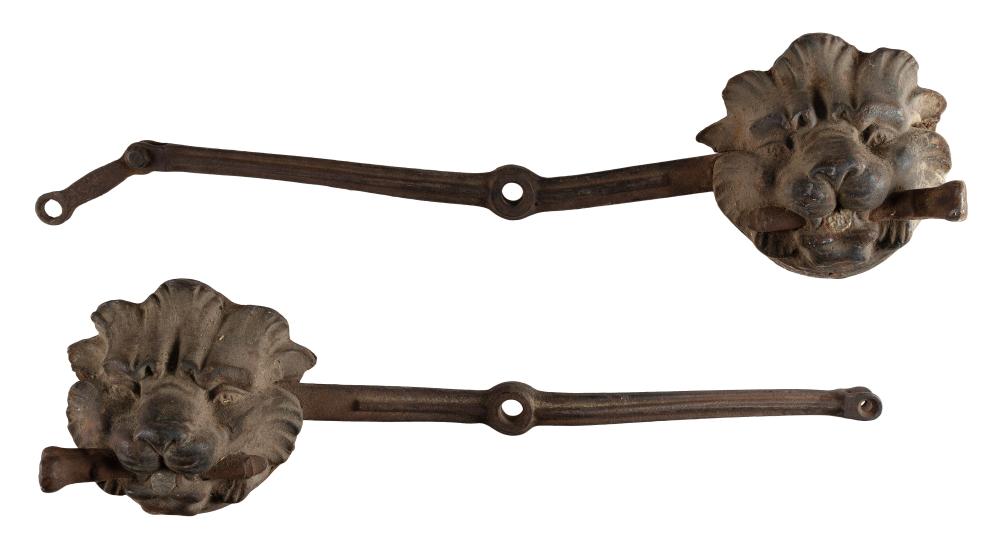 PAIR OF CAST IRON LION’S-MASK