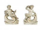 PAIR OF CAST STONE PUTTO GARDE