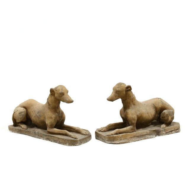 PAIR OF CAST STONE RECUMBENT GARDEN