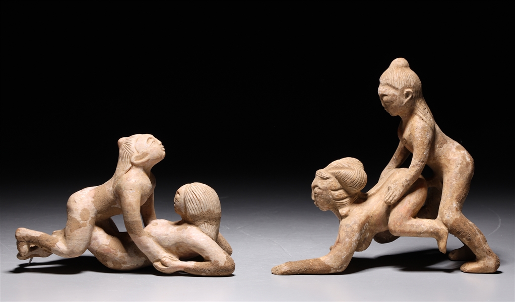 Pair of Chinese pottery figures,