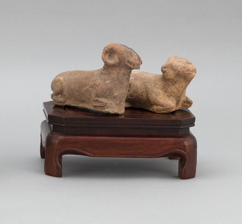 PAIR OF CHINESE POTTERY RECUMBENT