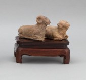 PAIR OF CHINESE POTTERY RECUMB