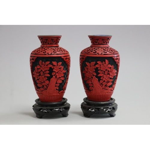 Pair of cinnabar vases on stands,