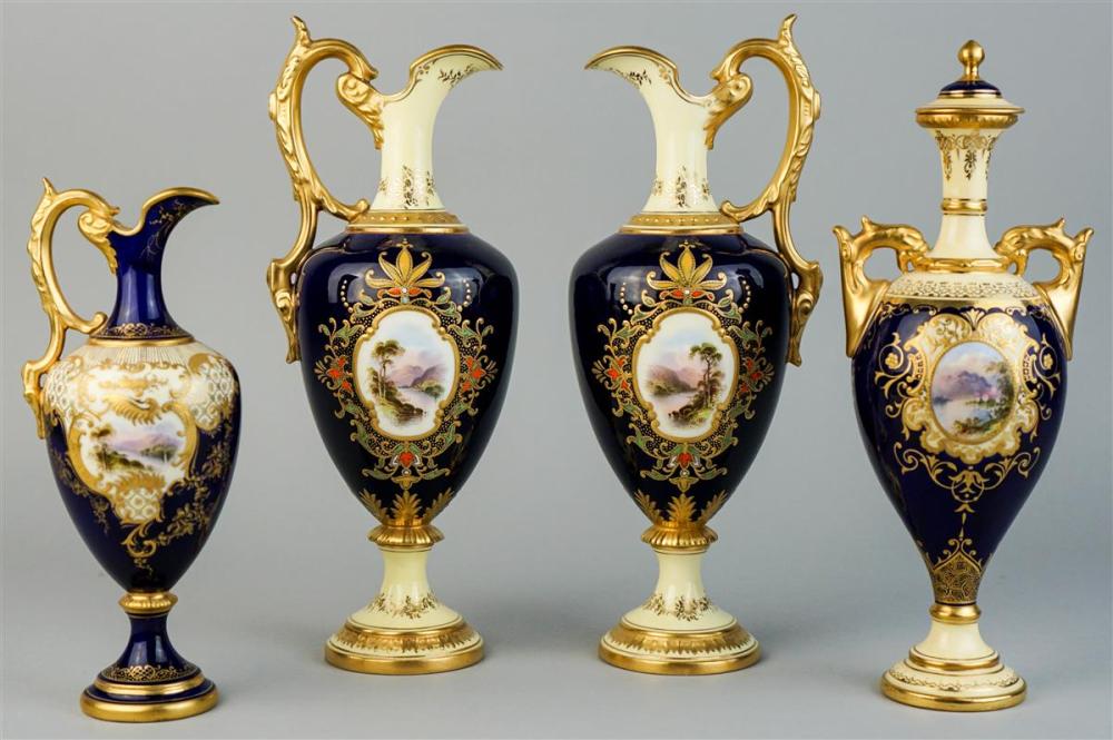 PAIR OF COALPORT JEWELED EWERS, A