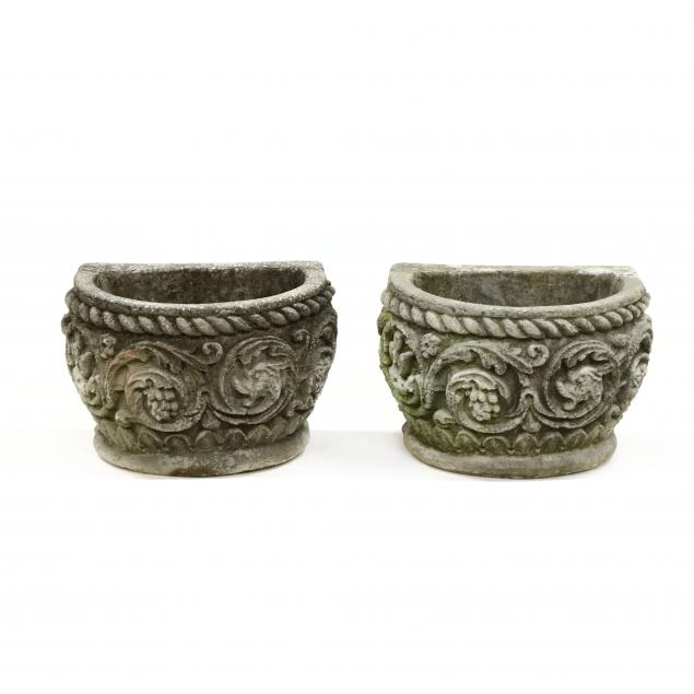 PAIR OF DEMILUNE CAST STONE