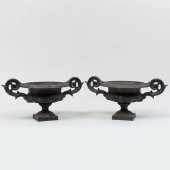PAIR OF EBONIZED CAST IRON GAR