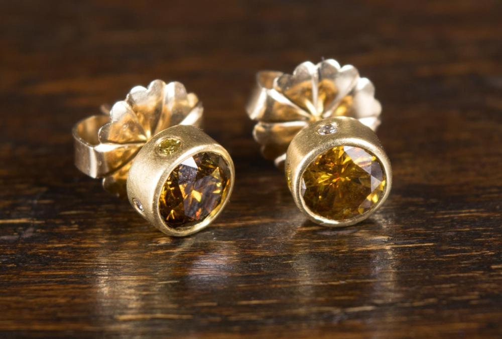 PAIR OF FANCY ORANGEY BROWN DIAMOND