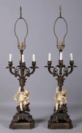 PAIR OF GLAZED POTTERY PUTTO L