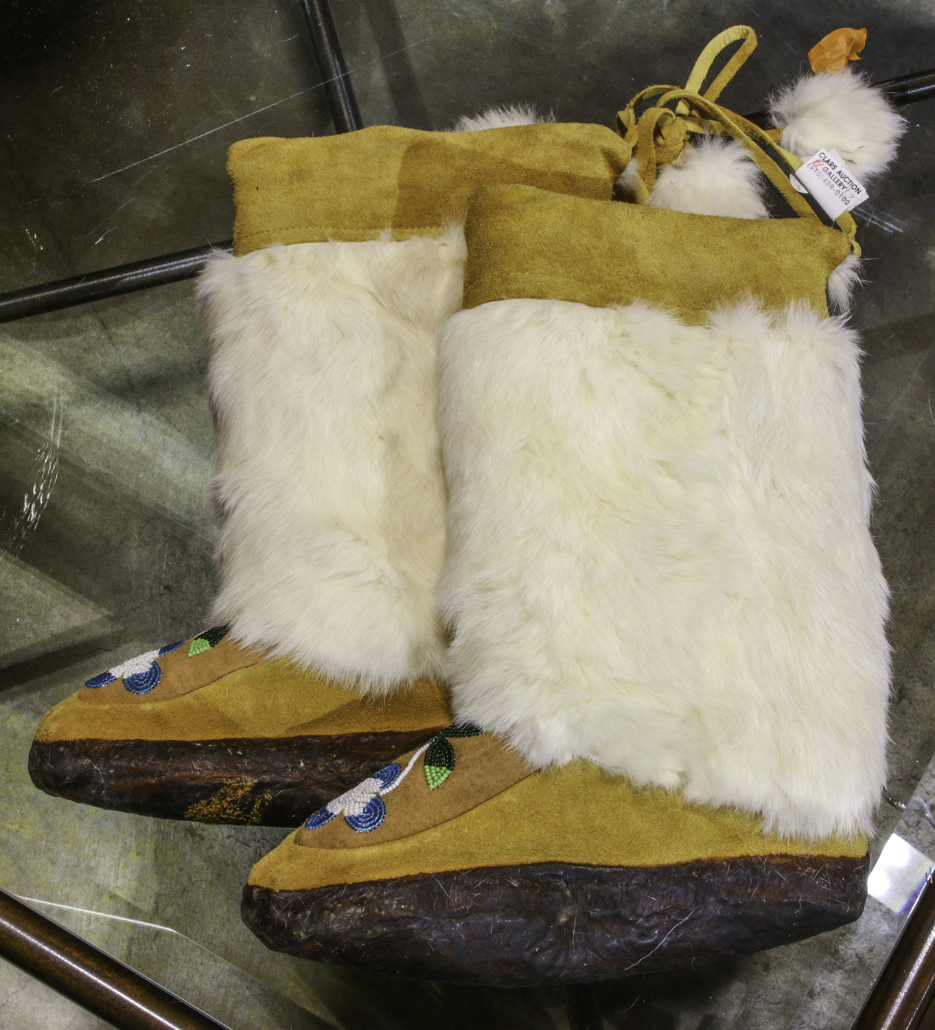 PAIR OF HIDE MOCCASIN BOOTS WITH