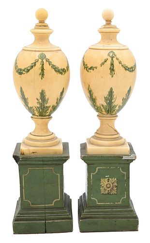 PAIR OF IVORY PAINTED URNS, EACH IN