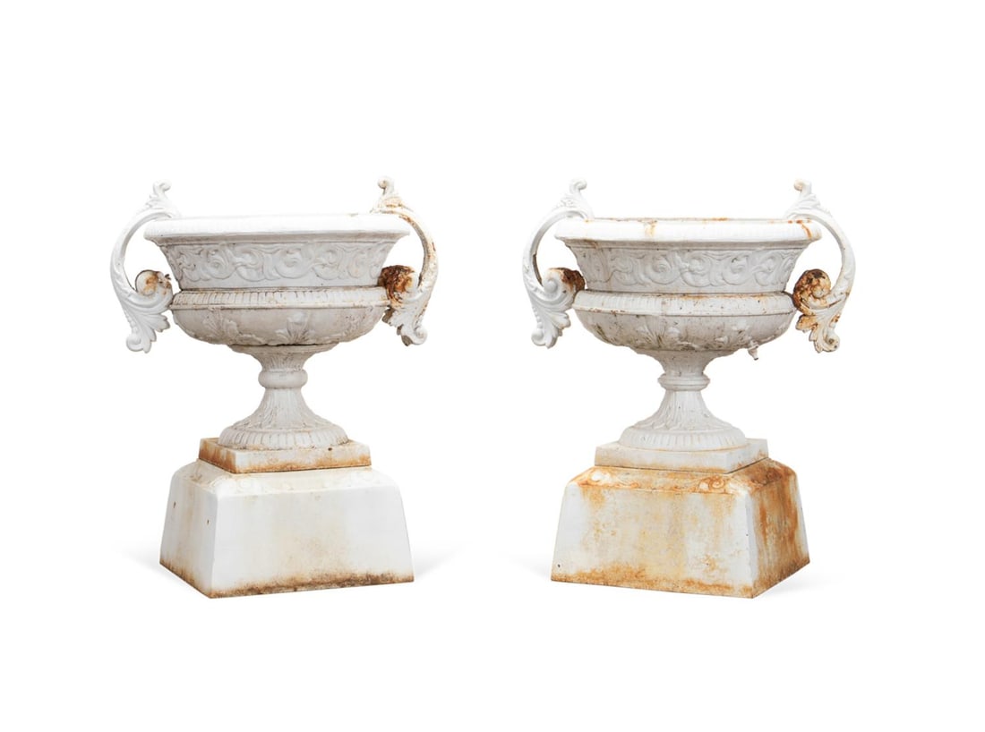 PAIR OF KRAMER BROS. CAST IRON URNS